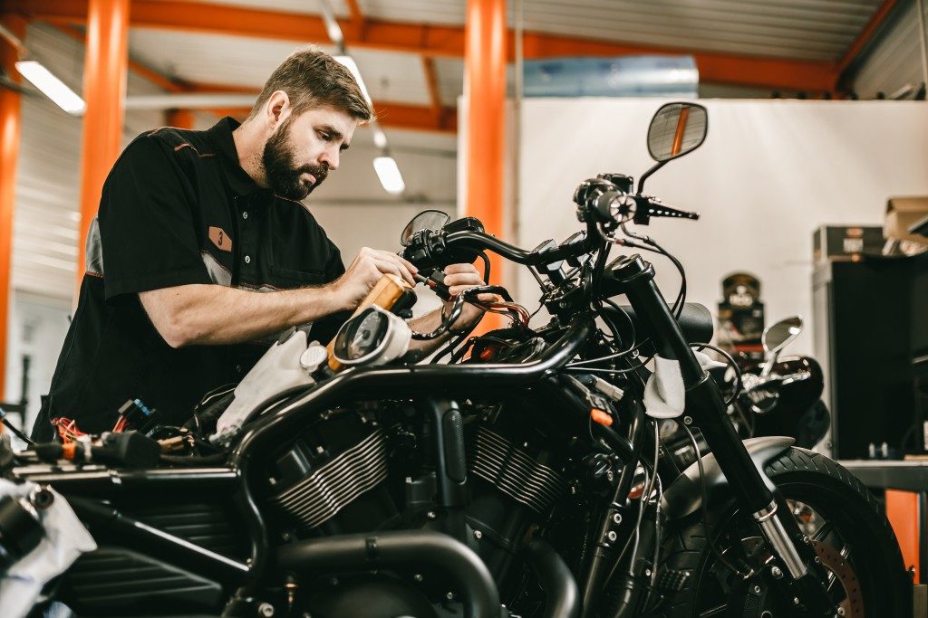 Man cleaning motorcycle