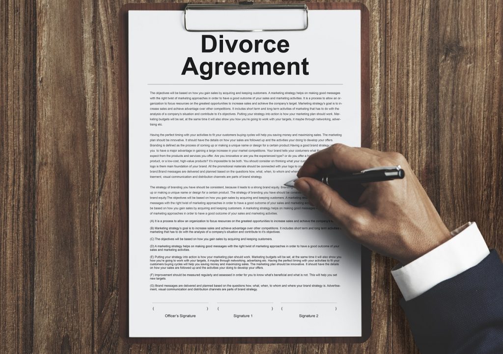 A divorce agreement being signed