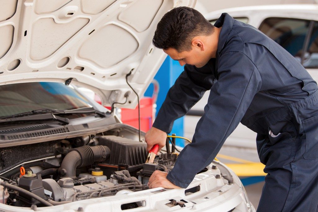 Mechanic doing some car tune up