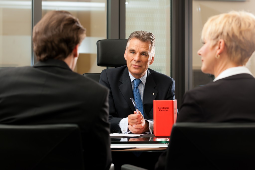 two clients talking to their new lawyer