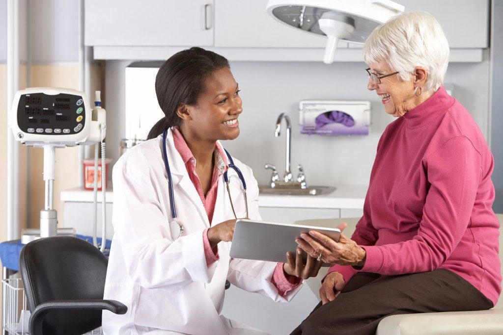 woman getting her checkup with doctor