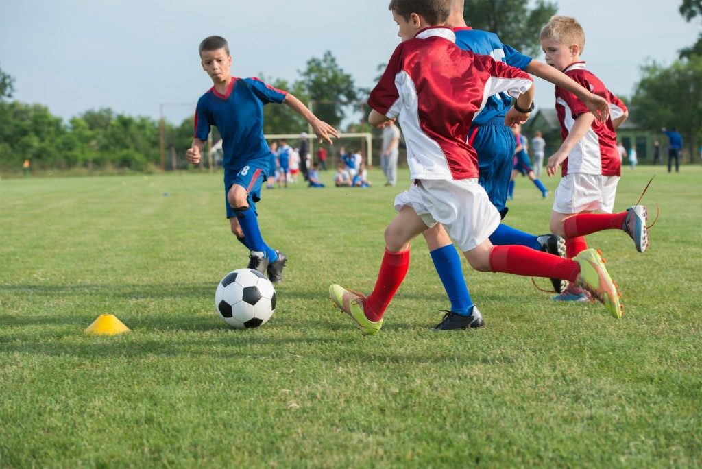 kids playing football