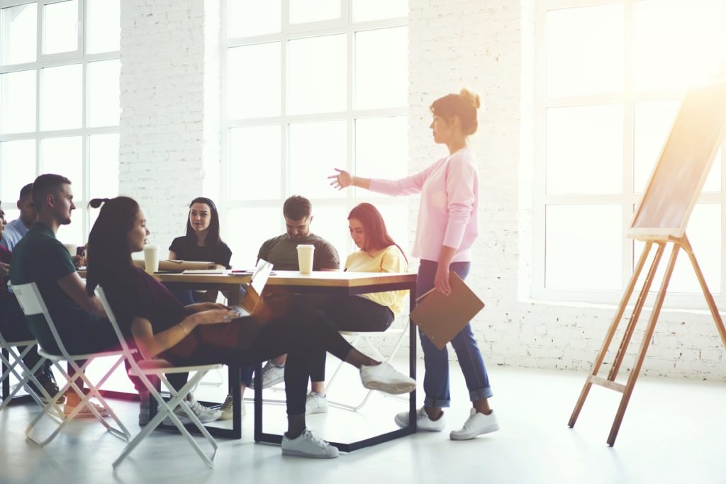 employees discussing a project in a conference room