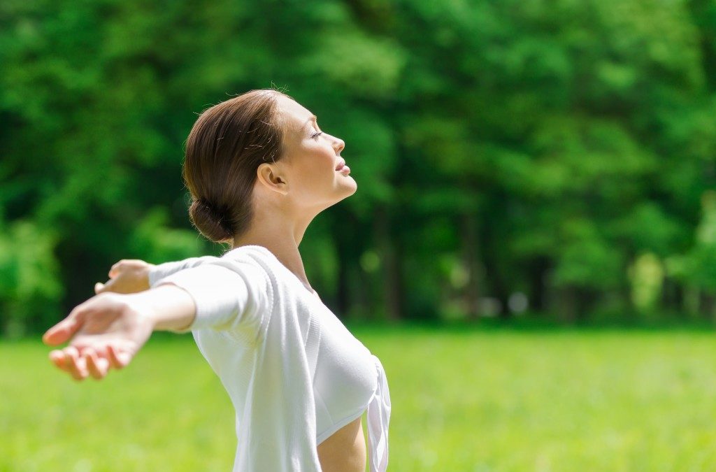 Woman raising her arms