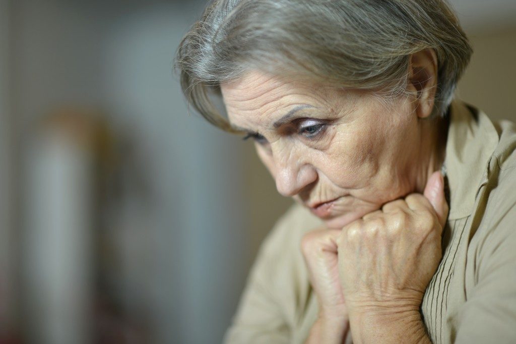 Sad elderly woman