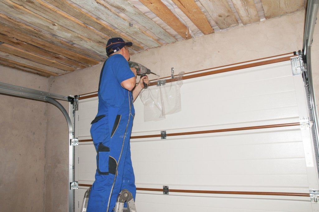 man improving garage door