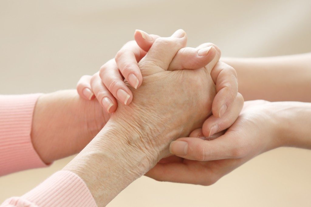 Helping hands elderly care concept