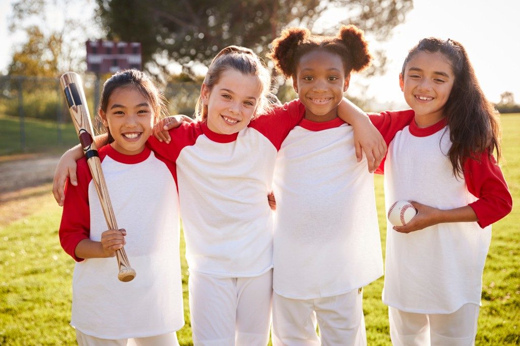 Little girls playing Baseball