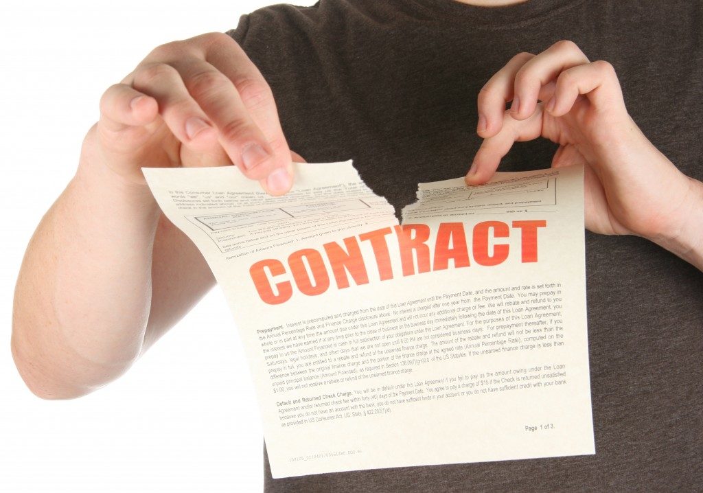 Person tearing a contract