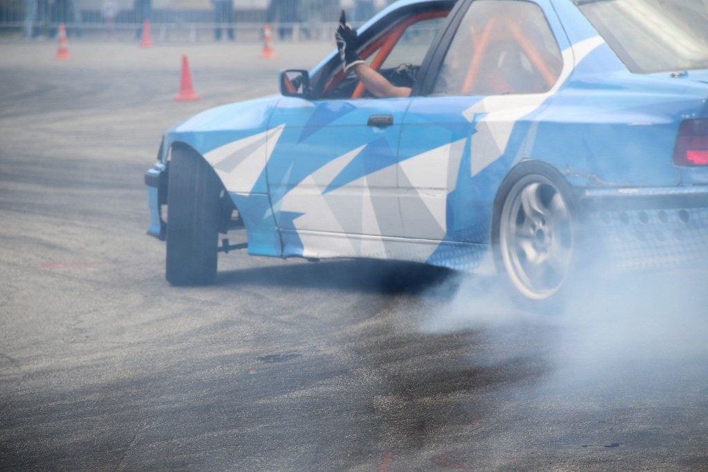 blue race car drifting