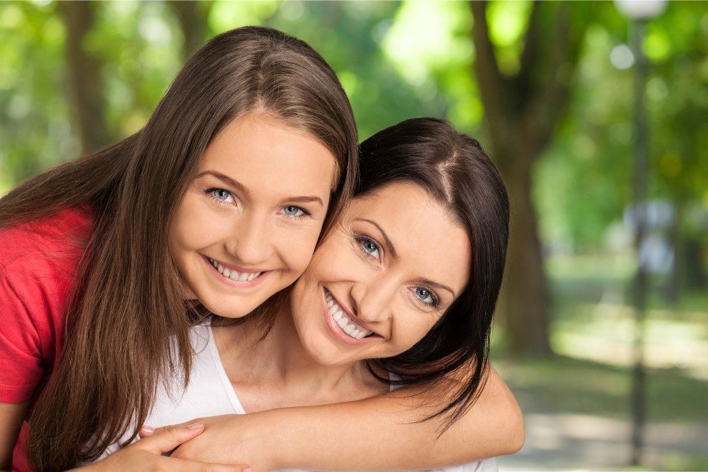 mother and daughter hugging