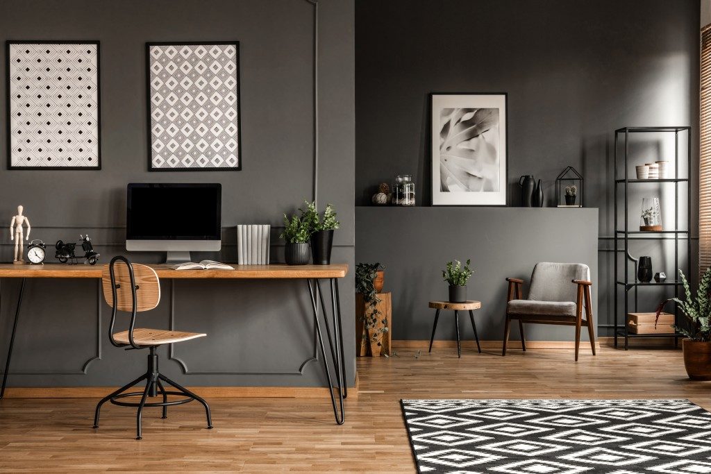 modern office with grey walls and wood furniture