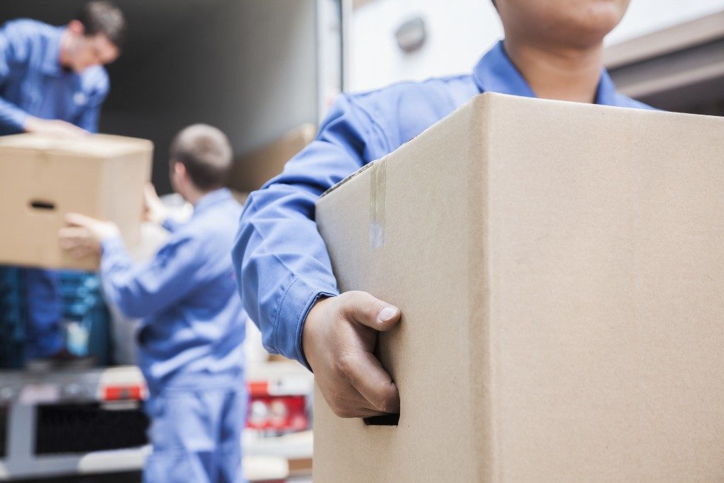 Movers unloading moving van