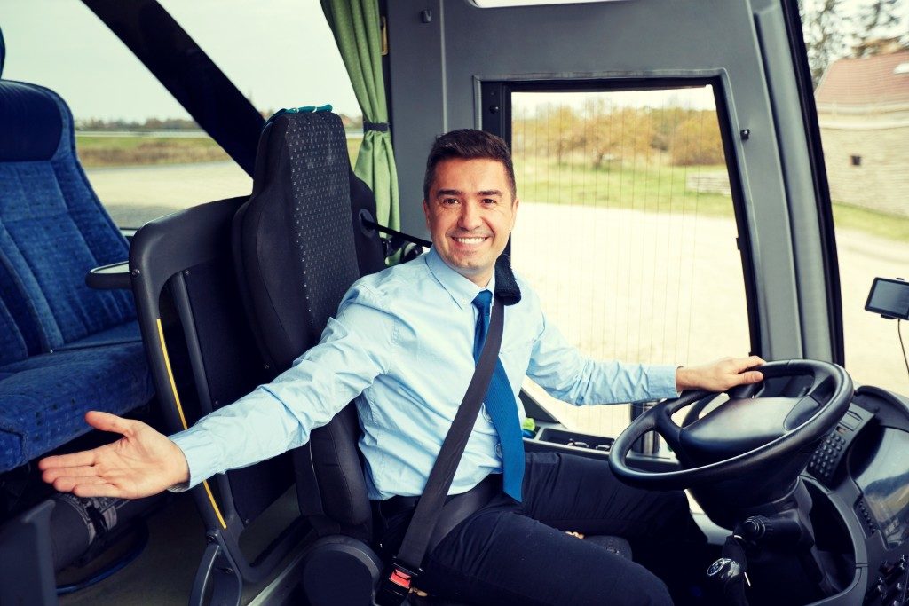 a welcoming bus driver