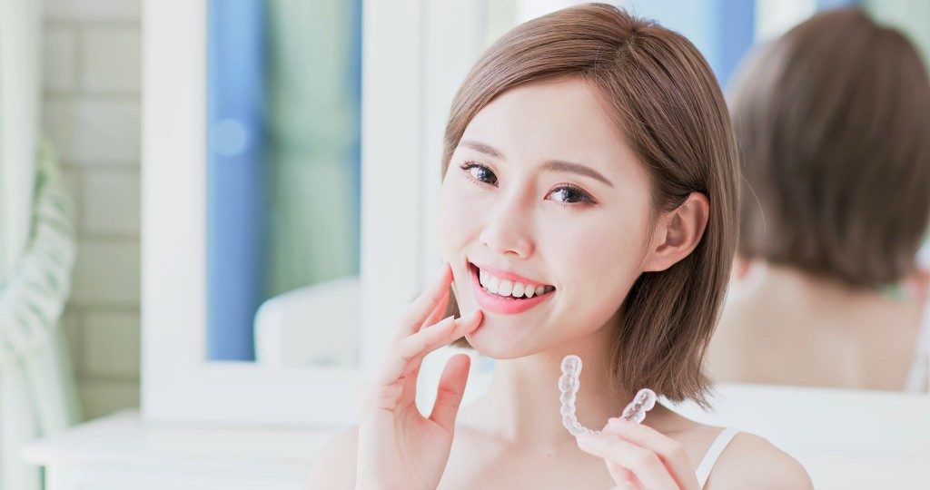 woman showing off her braces