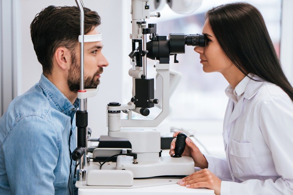 eye doctor examining a patient