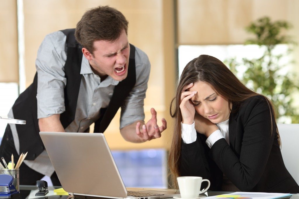 Boss shouting at an employee