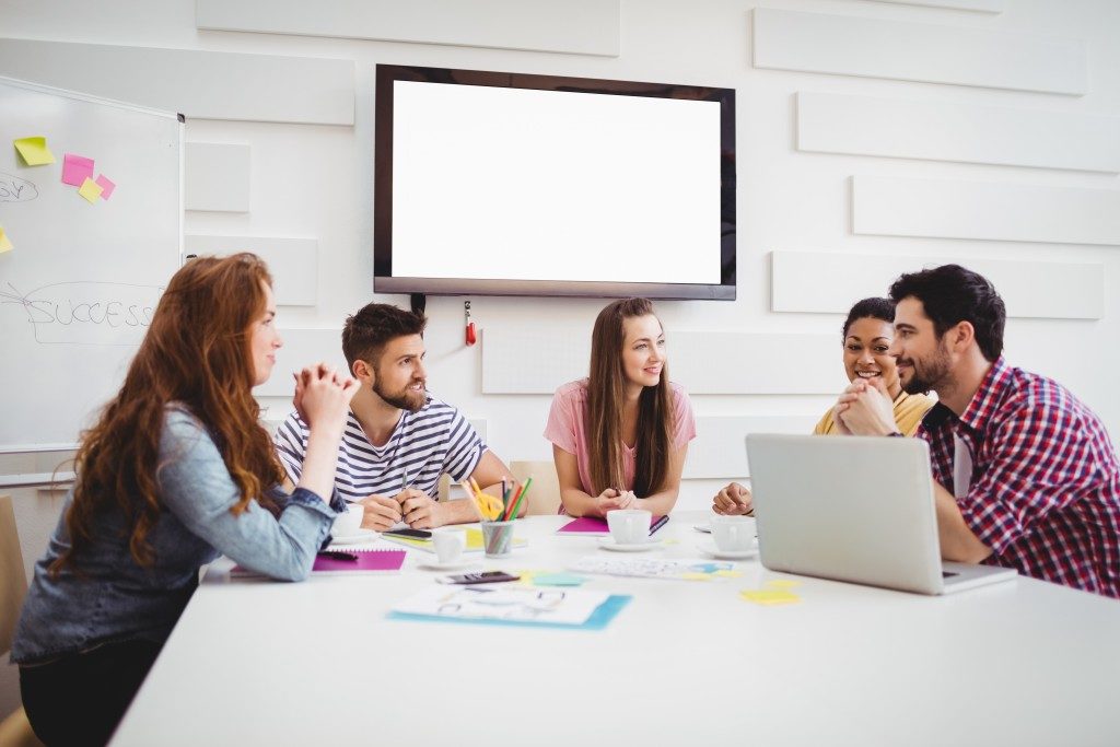 team of employees having a meeting