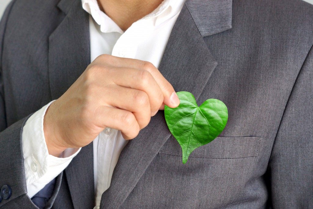 businessman with a heart shaped leaf