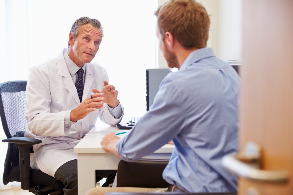 man consulting to a doctor