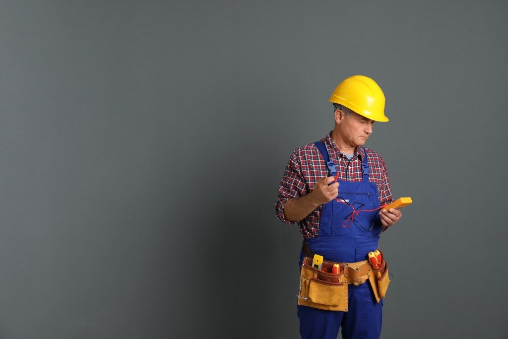 Maintenance man on grey background