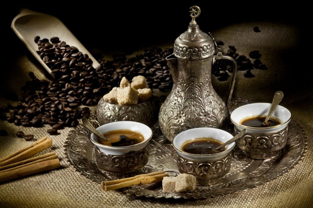 Turkish coffee pot with hot coffee