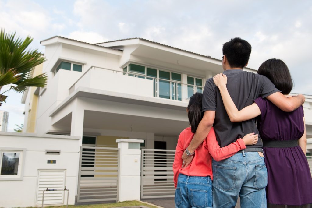 family outside their house