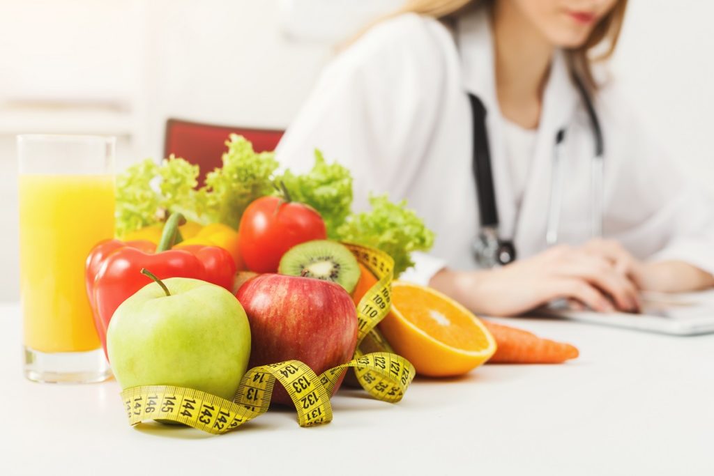 dietitian with fruits and veggies