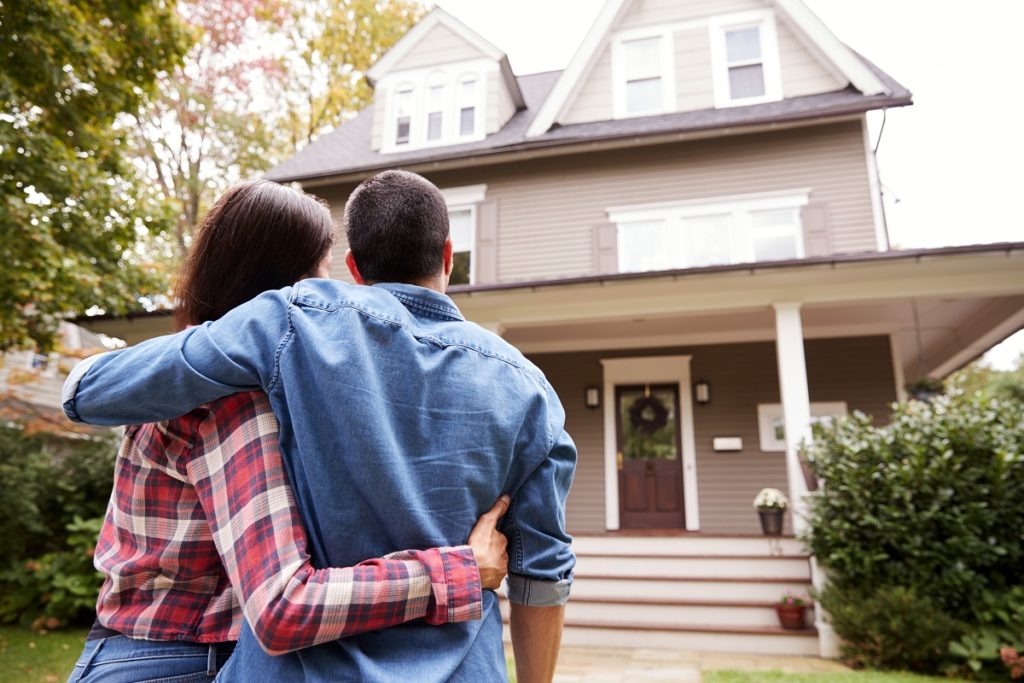 Couple looking at their house