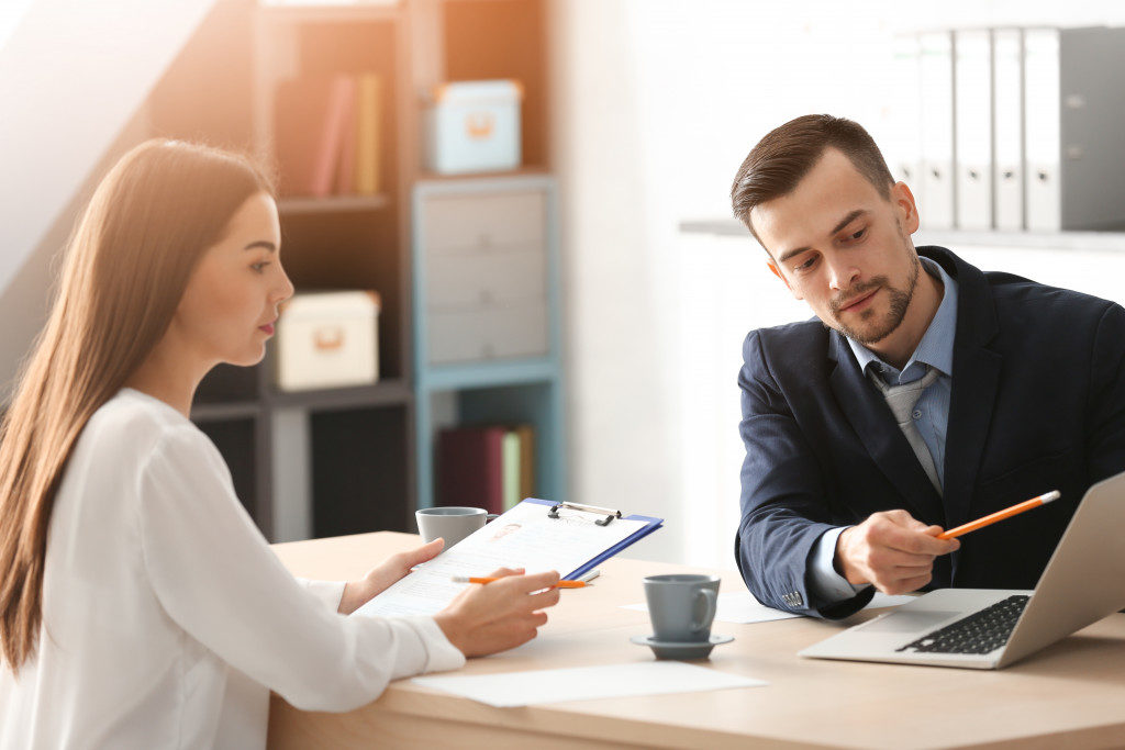 interviewing young man in office