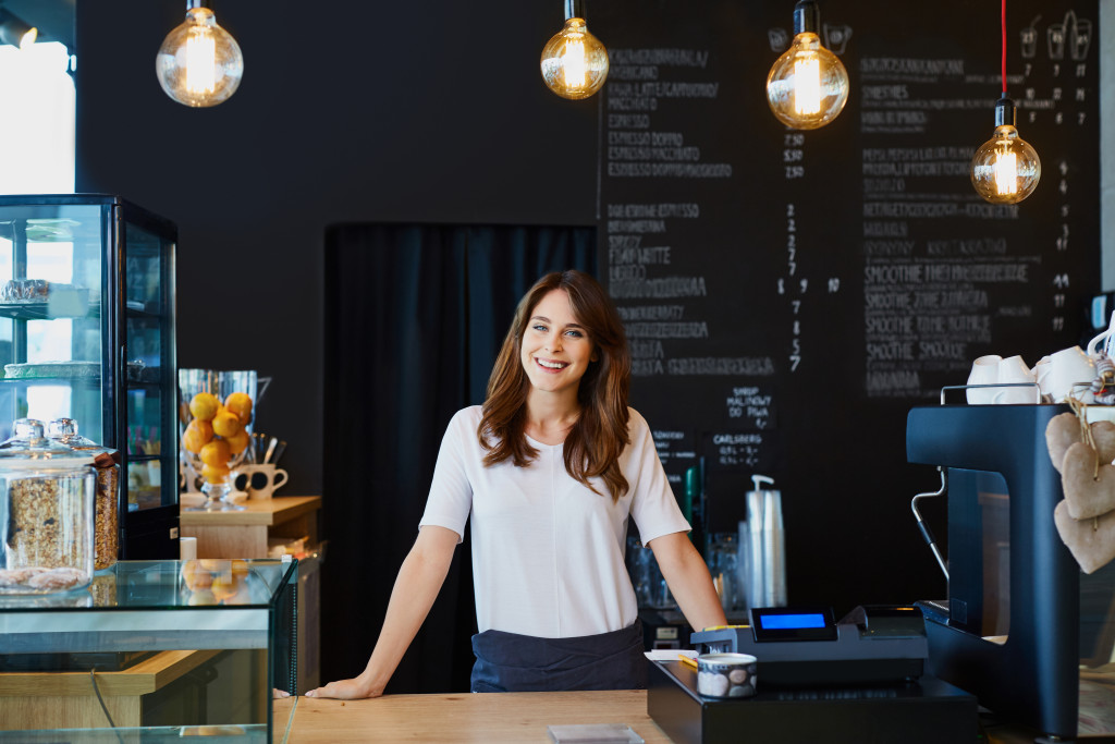 woman at a small cafe