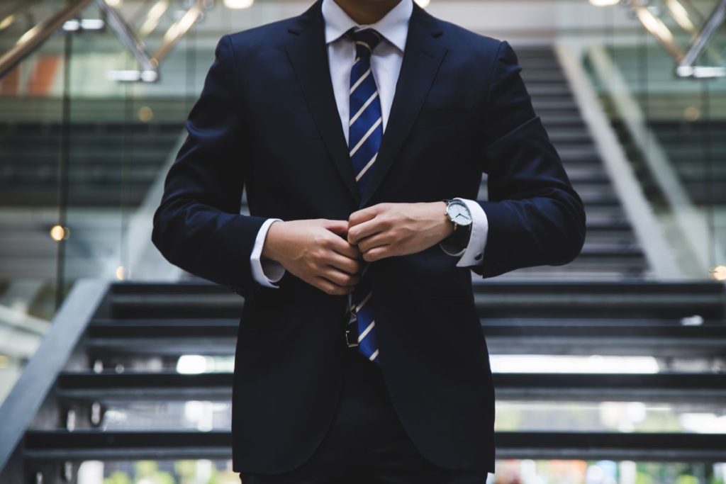 businessman adjusting suit