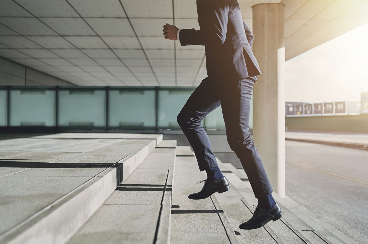 businessman walking up steps