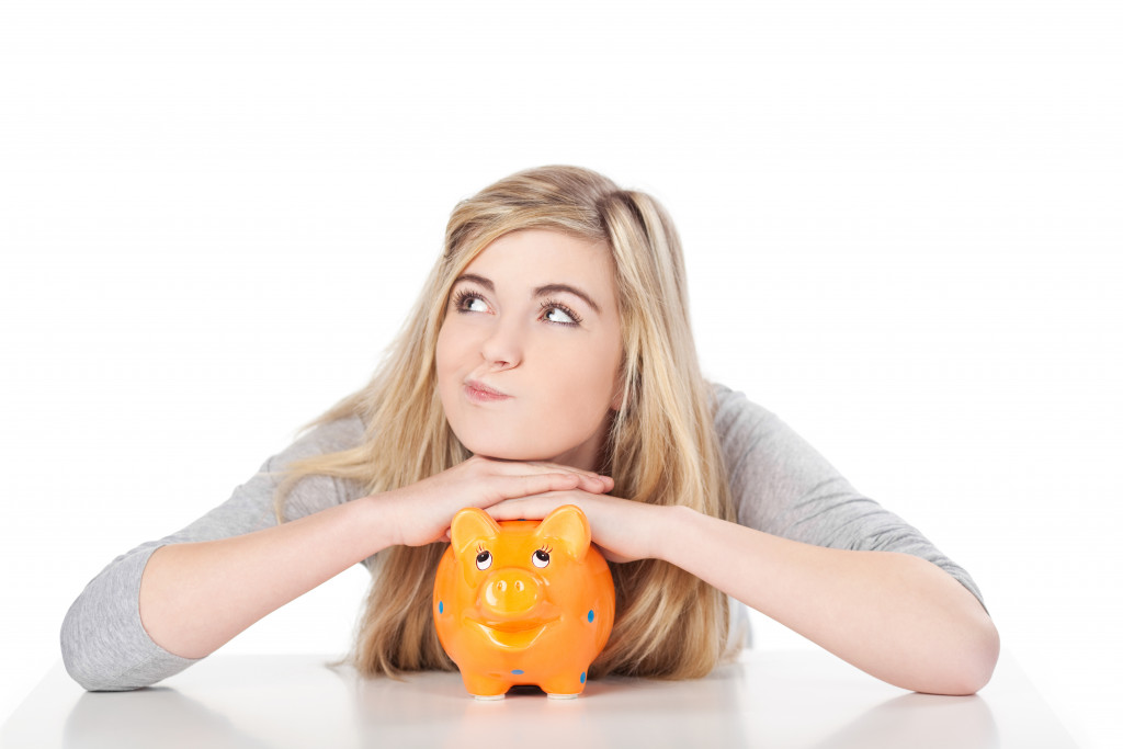 woman thinking of investing her money