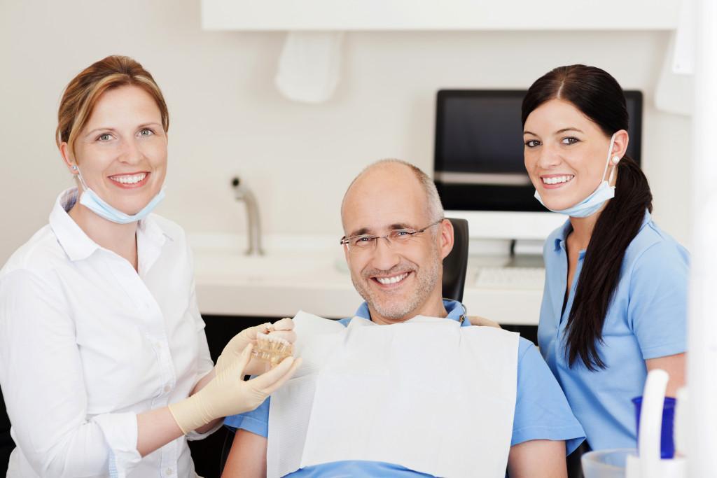 a dental patient at a dentist clinic with dental model