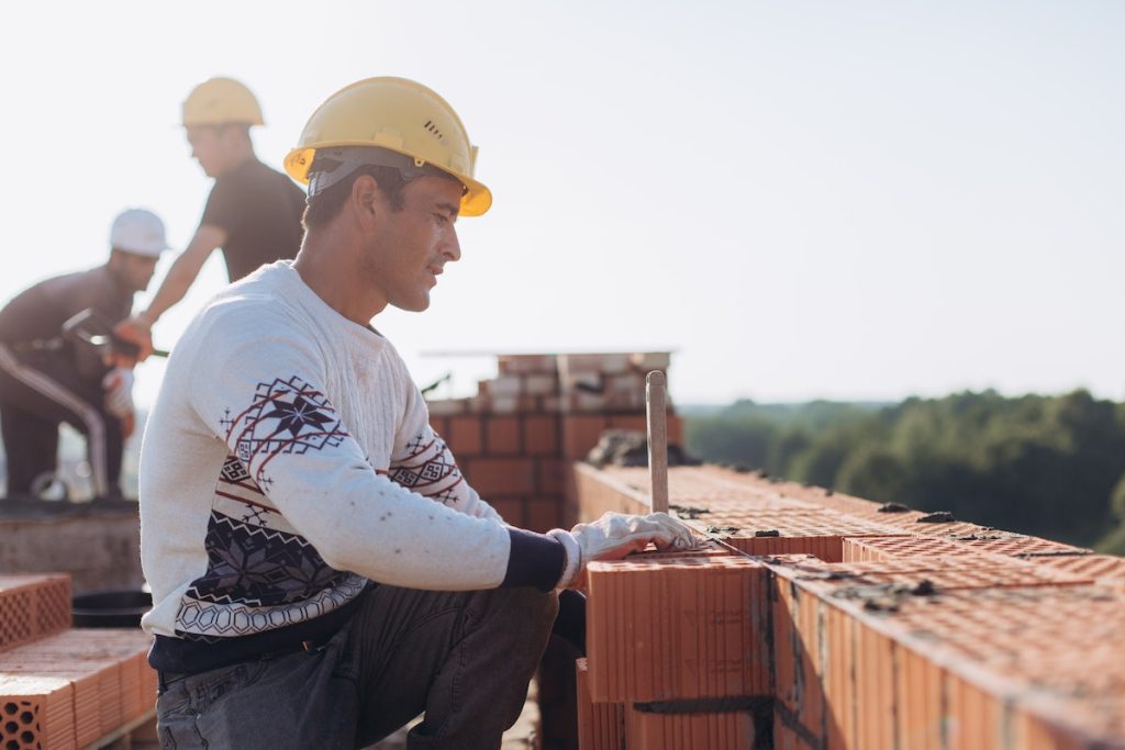 Brick Workers at Construction Site